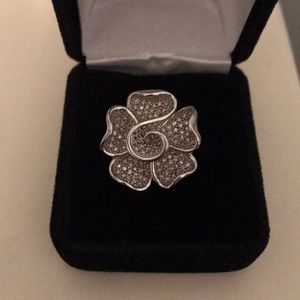 Flower ring with cz’s inside leaf.